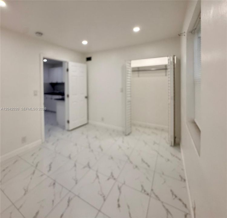First bedroom with illuminated clóset