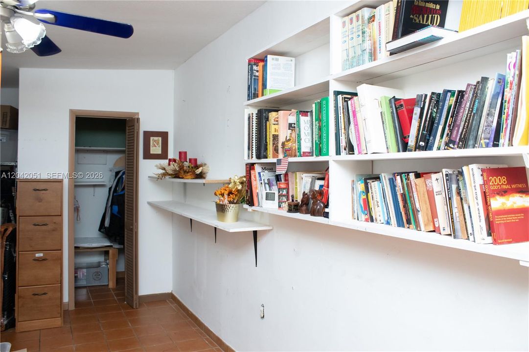 This is the Florida Room that is off of the current Dining Room. To the left of this photo there are two doors, one leads to the backyard and the other leads to the hallway bathroom. This room is currently used as a storage room.