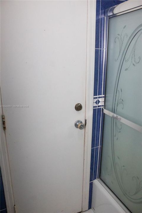 The part of the bathroom with the bathtub also has a door that leads to the Florida Room.