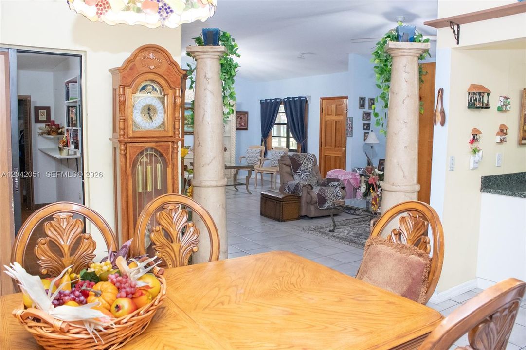 The current dining area is between the kitchen and the patio and has the Florida Room across and the living room area diagonal to it