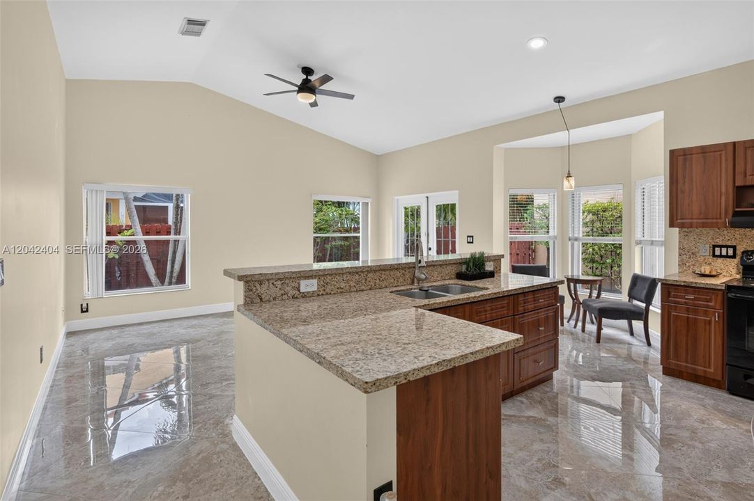 Open family room  adjoining kitchen area.