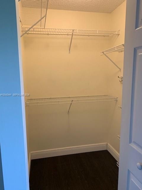 Walk in closet in the primary bedroom.
