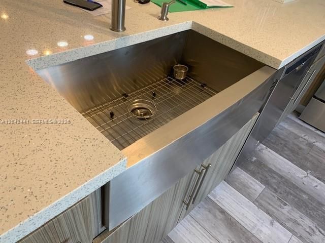 Quartz countertops and large farmhouse sink.