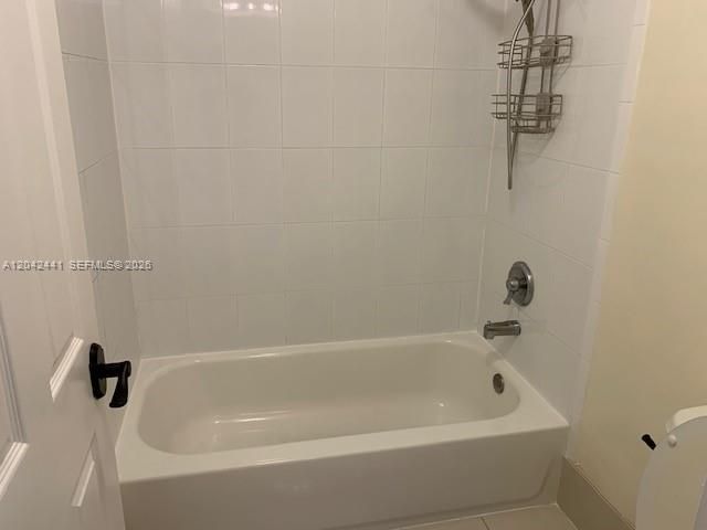Full Bathroom with a bathtub shower combo.