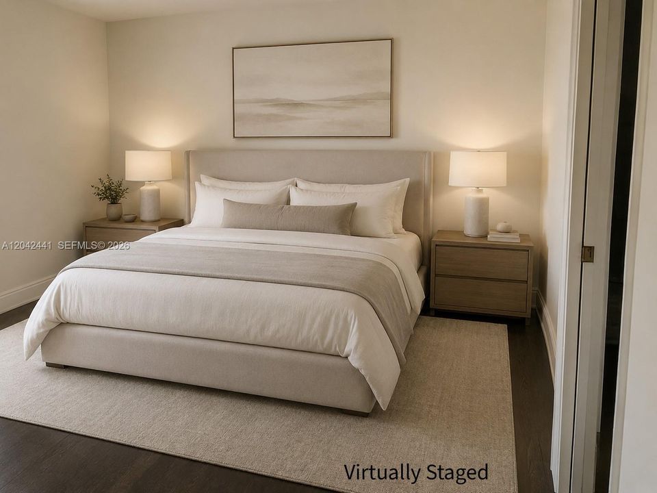 Primary Bedroom with a walk in closet and vaulted ceilings.