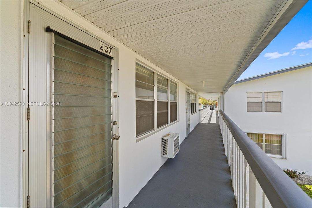 Well-maintained second-floor hallway with natural light
