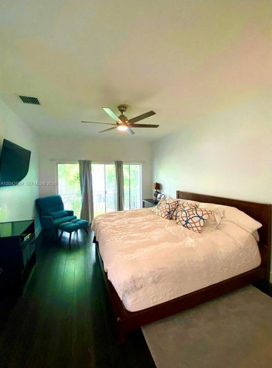 Primary Bedroom w Balcony over Garden