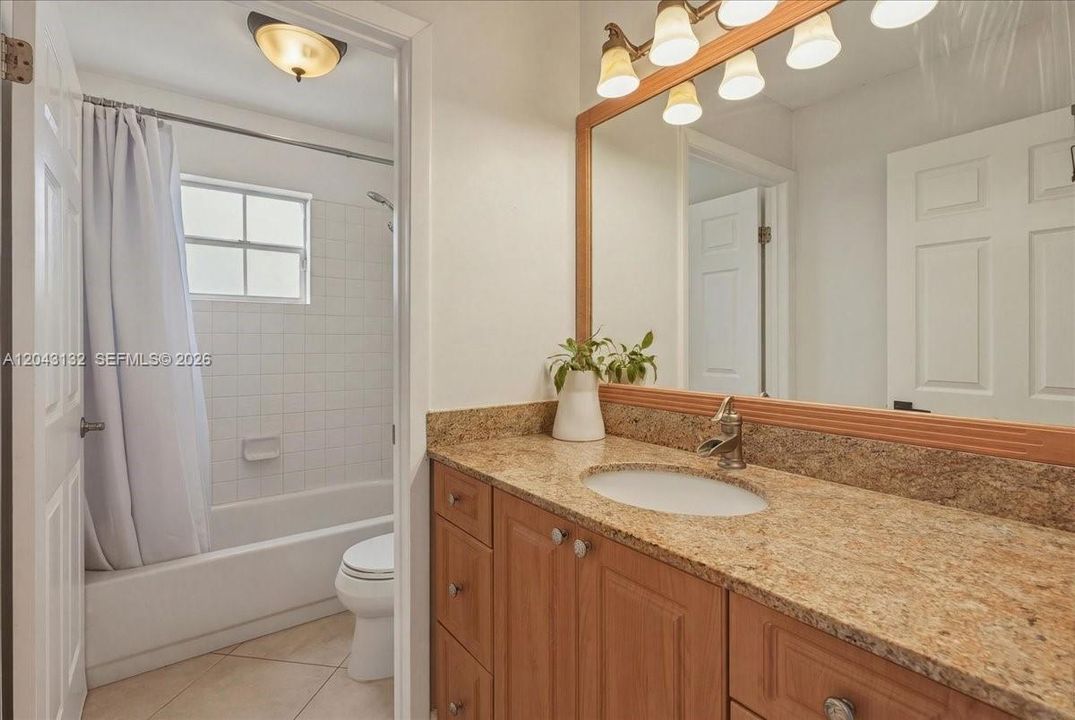 Second bathroom with a door giving privacy when you take a shower.