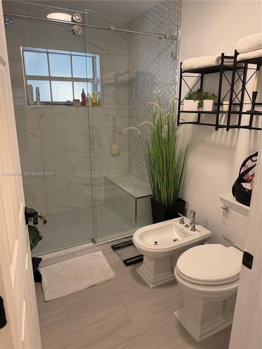 The Master bathroom has kohler bidet and toilet.