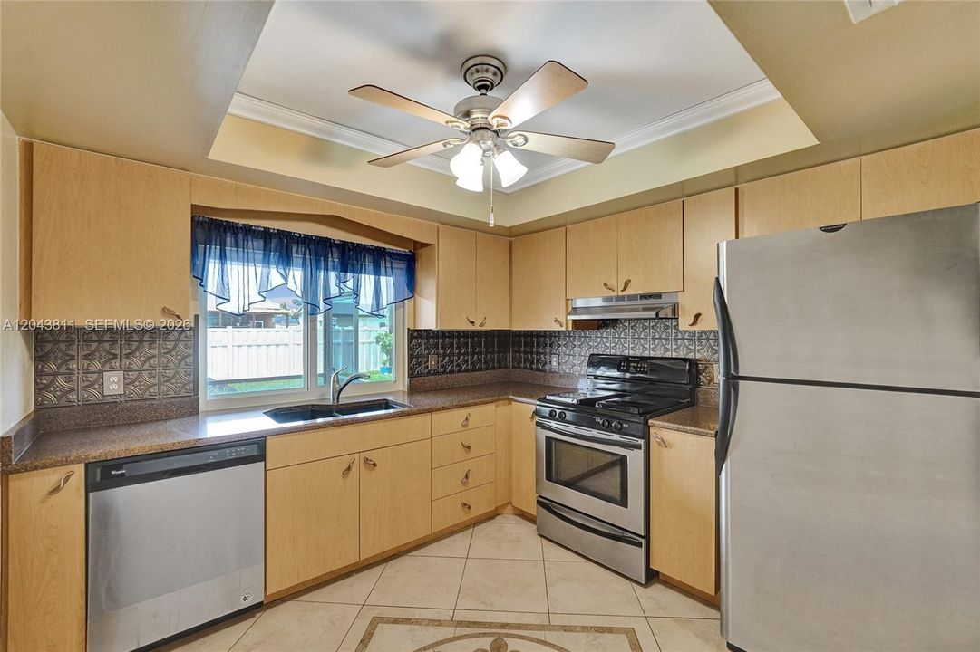 KITCHEN OVERLOOKS THE PATIO & BACKYARD
