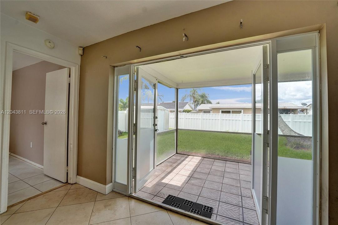 DOUBLE DOORS LEADING TO PATIO