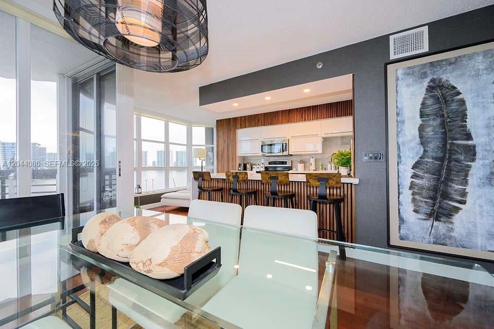 Dining room open to modern kitchen