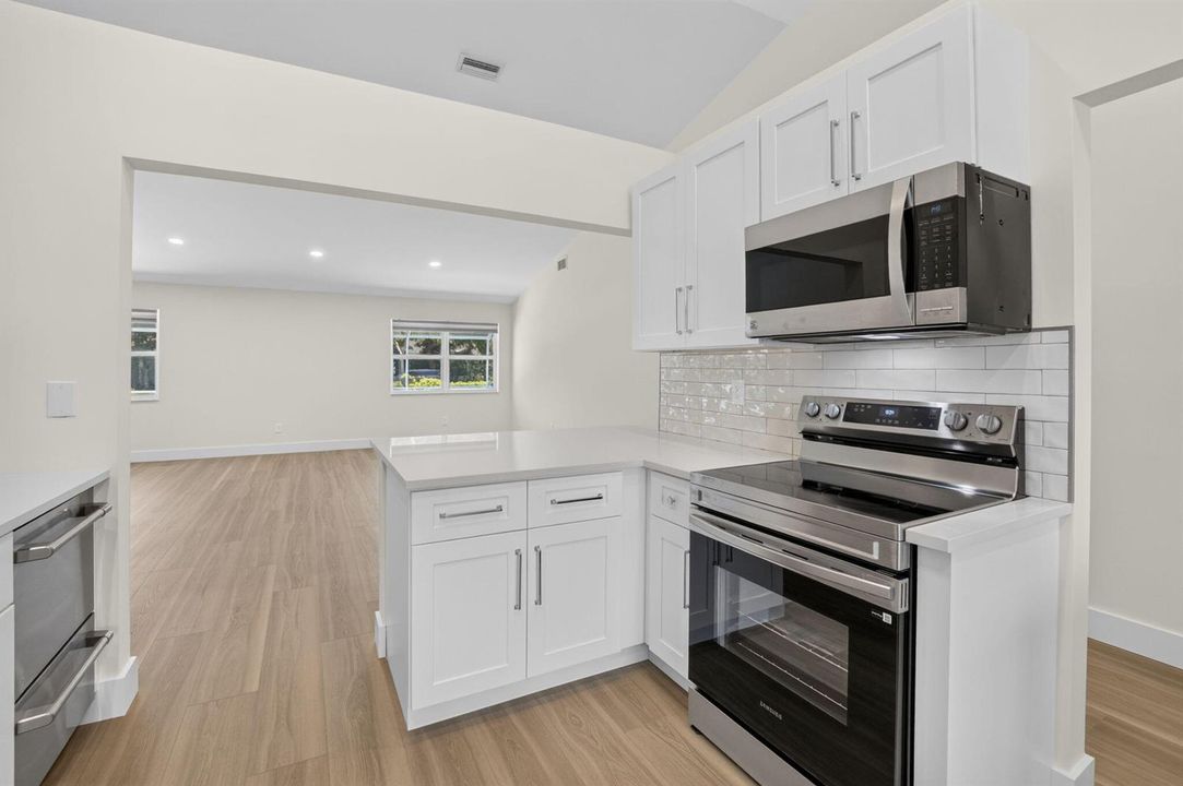 KITCHEN LOOKING INTO GREAT ROOM