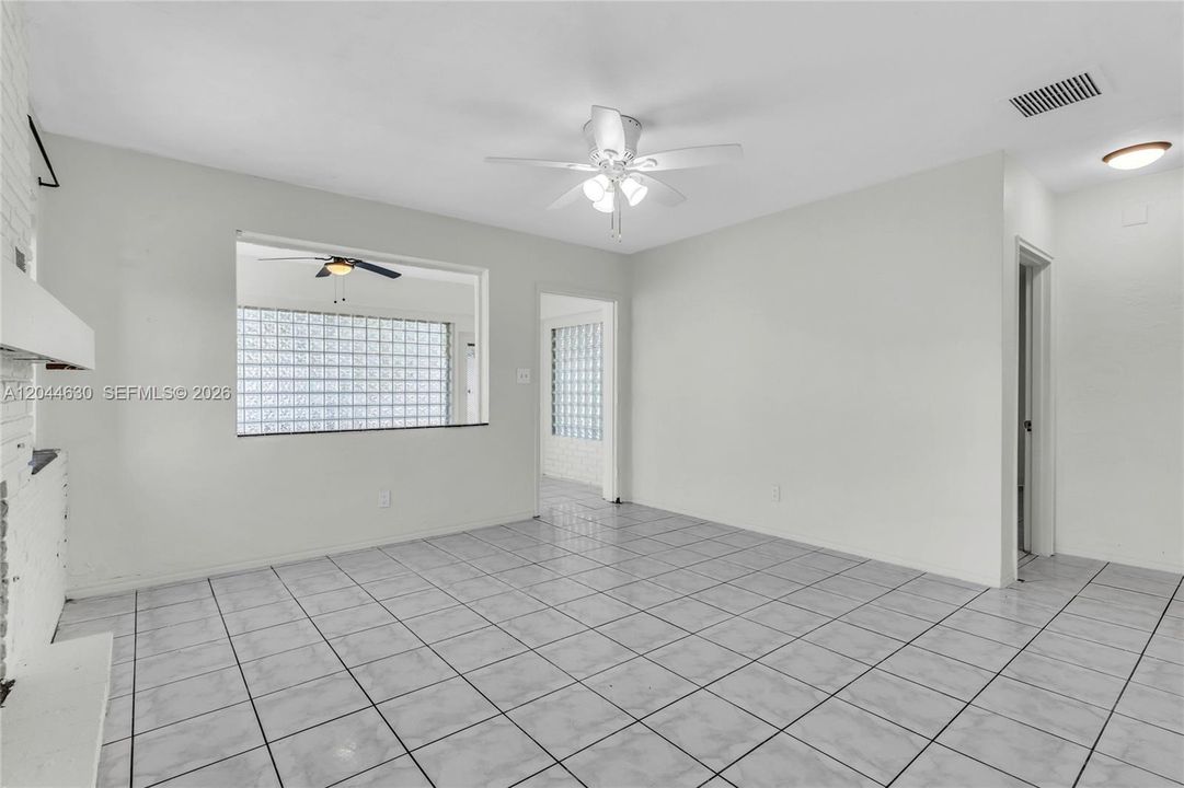 Middle area living room between bedrooms, kitchen, and sun room.