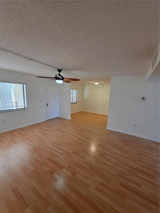 ENTRANCE TO UNIT LIVING ROOM LEADING TO CONVERTIBLE DEN