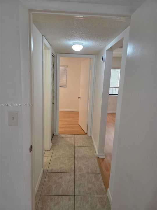 HALLWAY TO BEDROOMS AND HALL BATHROOM
