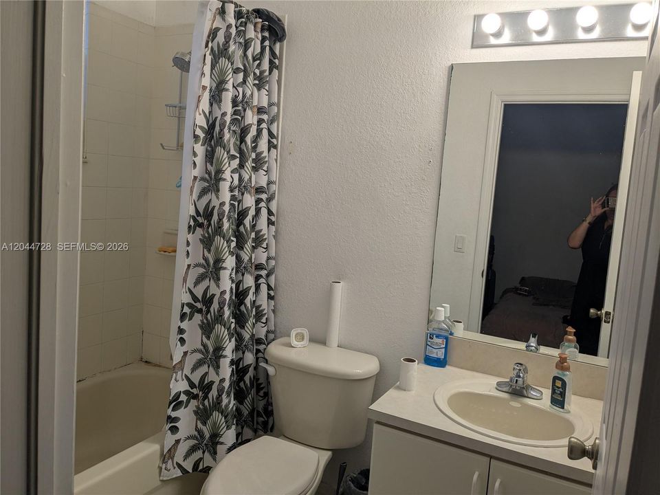 2nd Master Bathroom with white tile flooring, tub and a simple, functional layout, simple layout.