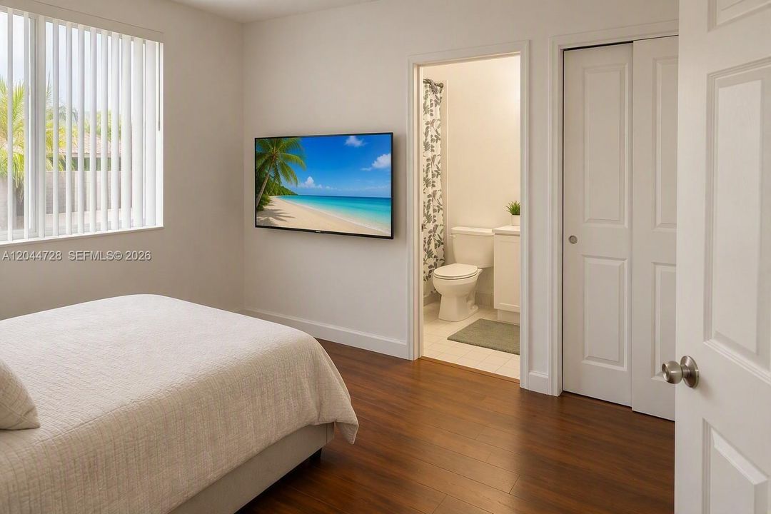 2nd Mater Bedroom with laminated flooring, simple layout.
