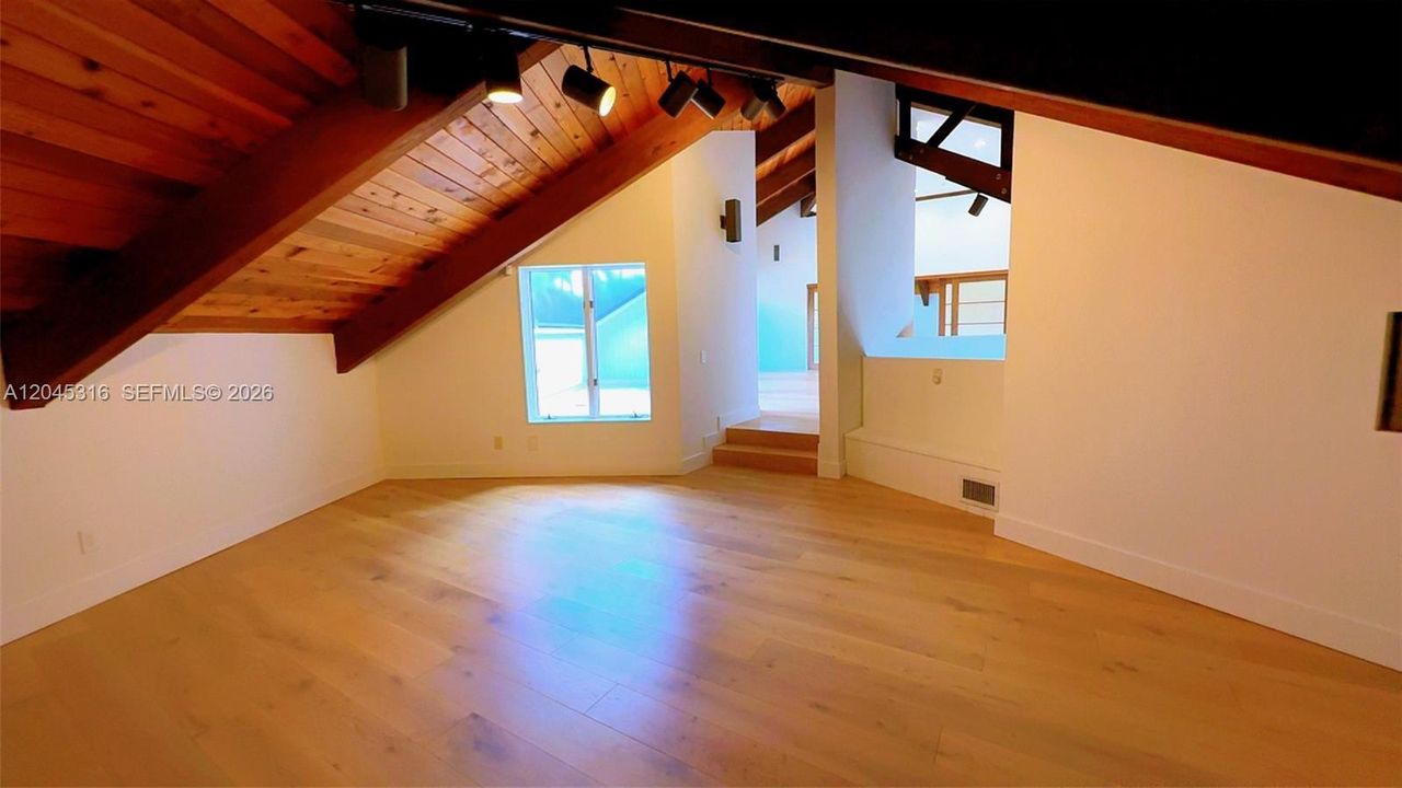 View facing loft sitting area from bonus room