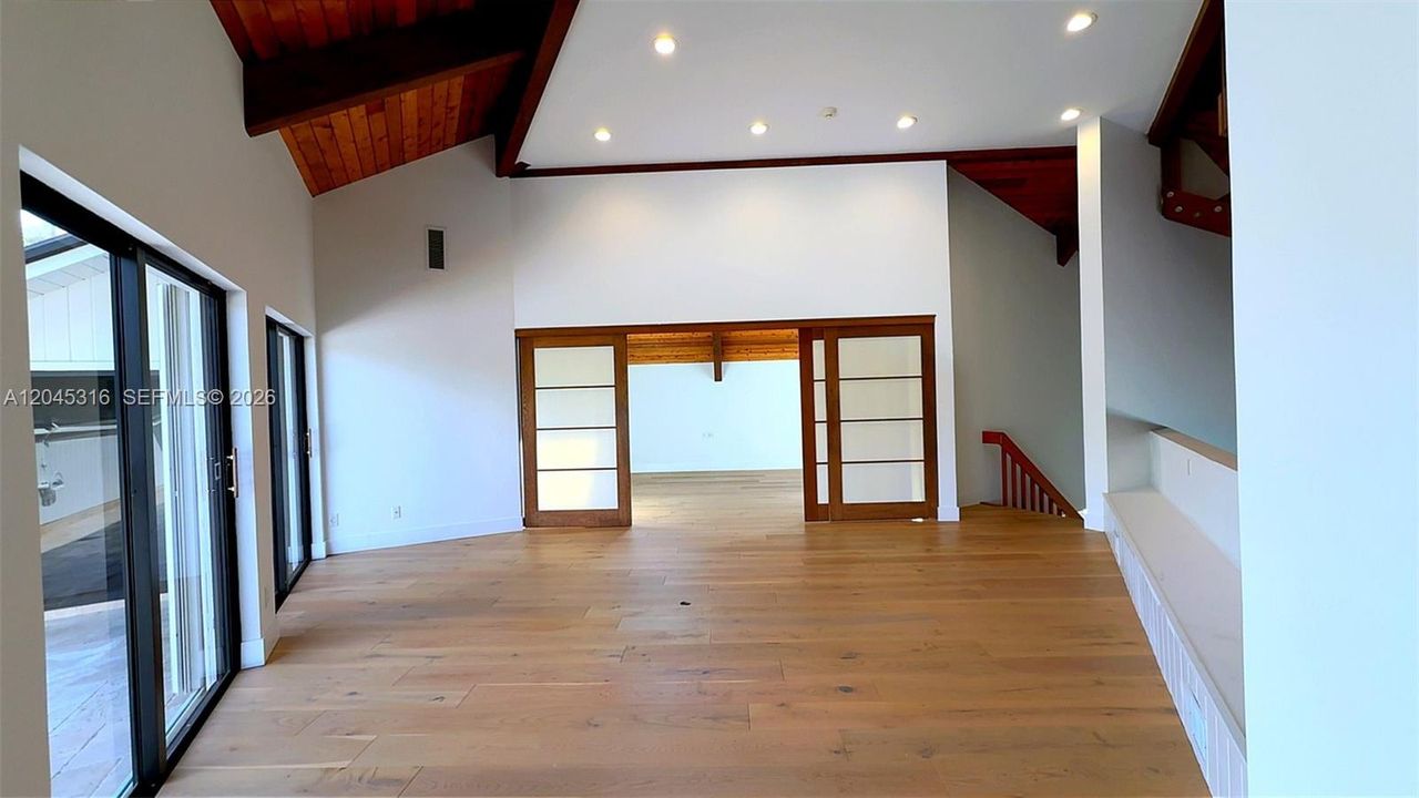 Loft bonus room looking into master bedroom