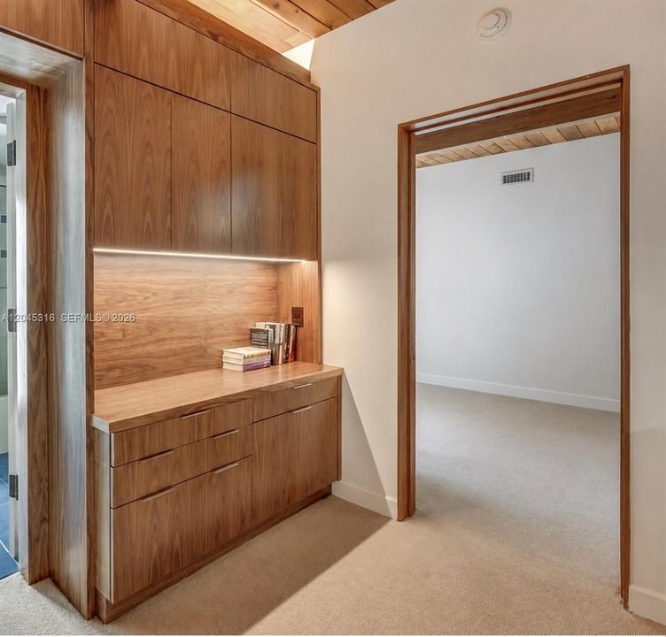 Located in center of bedroom area off kitchen