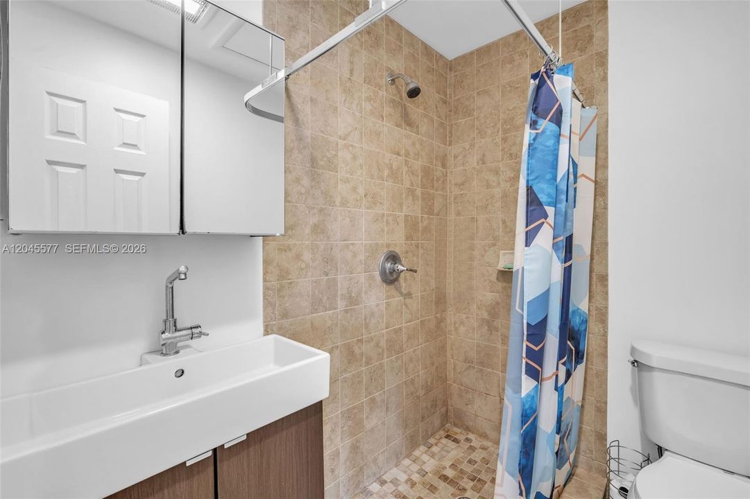 in-suite bathroom for the bedroom on the opposite side of the other three rooms