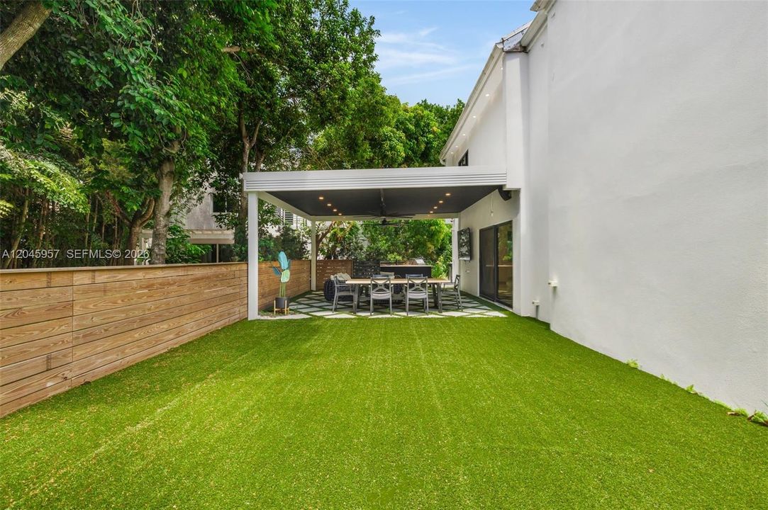 Professionally redesigned outdoor spaces create a private, low-maintenance backyard ideal for entertaining, family gatherings, or quiet evenings at home.
