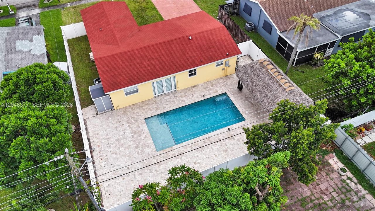 Pool and Travertine Deck with Tiki Hut