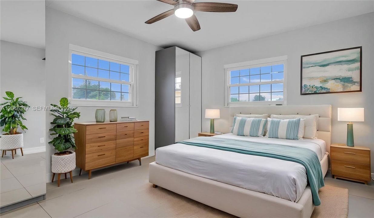 Primary with 2 mirrored closets and a deep closet virtually staged