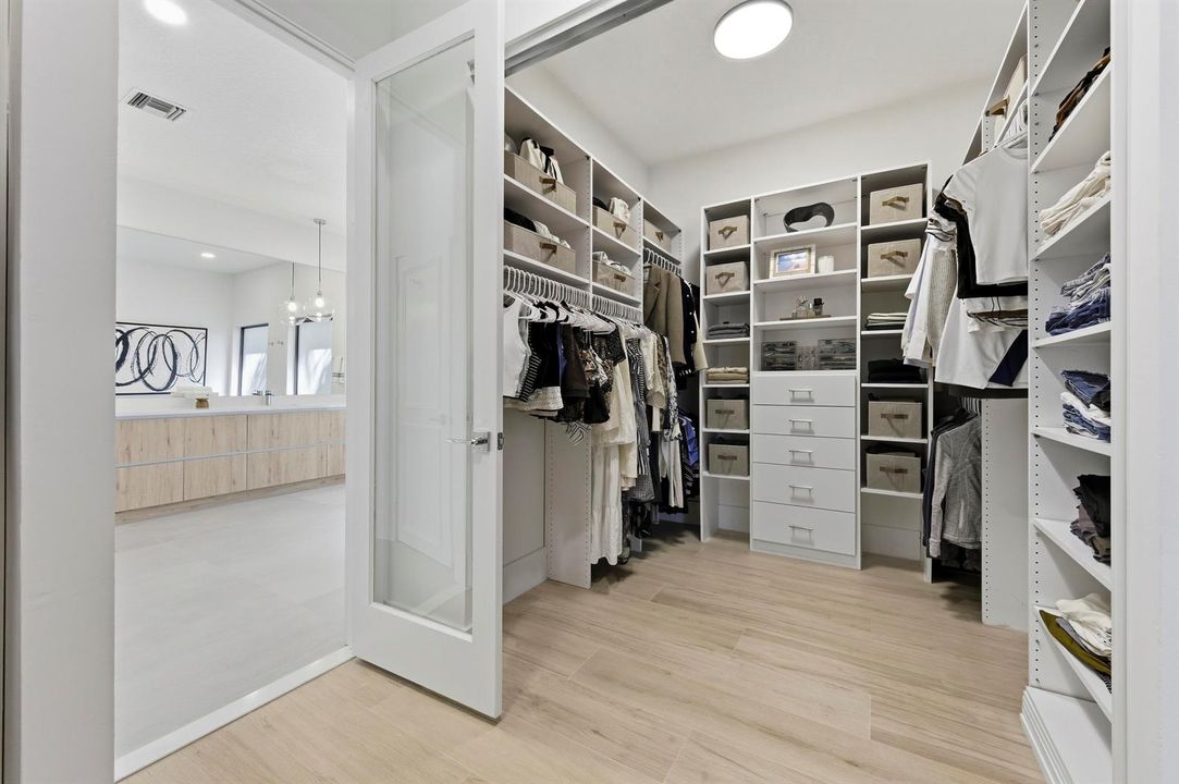 PRIMARY WALK-IN CLOSET - HERS