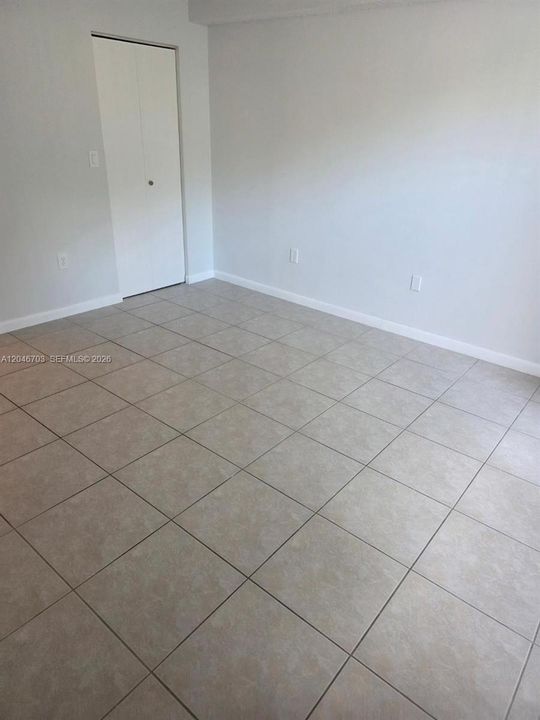 master bedroom with walk in closet