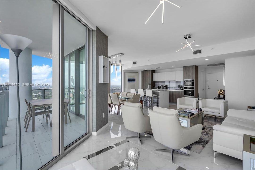 Corner living room with sliding glass doors to the terrace