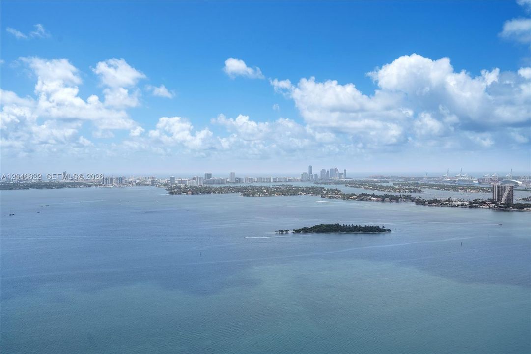 Sweeping Biscayne Bay and island views from a high floor