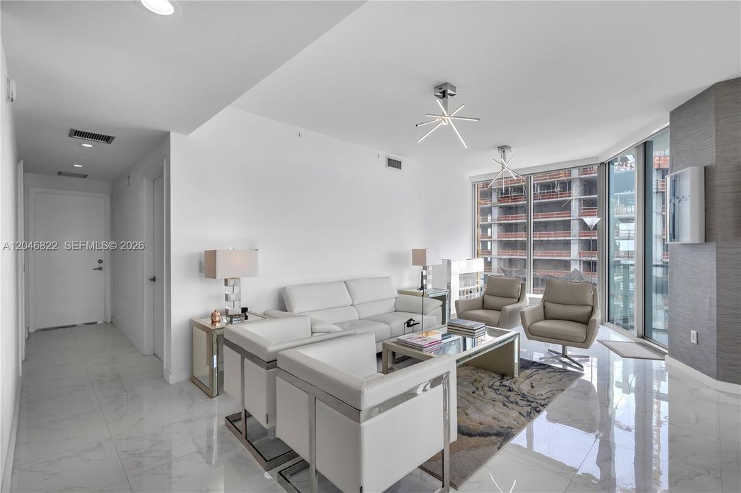 Bright living space opening to the dining area and terrace