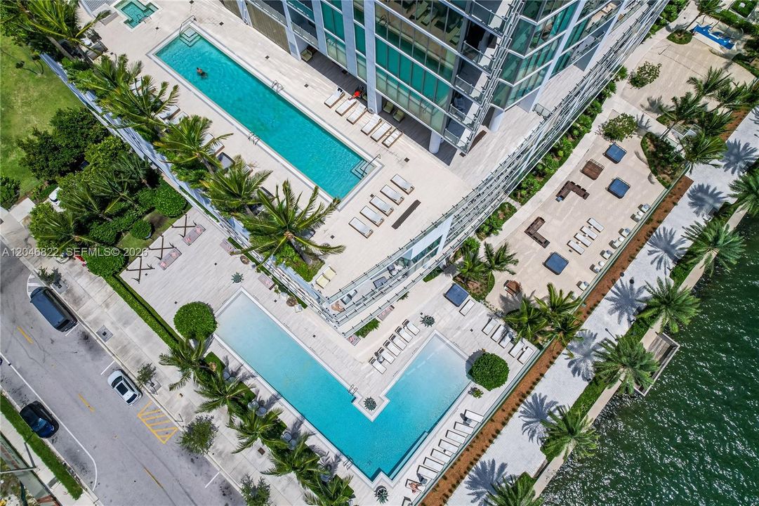 Aerial of the pool terrace and bay frontage at Biscayne Beach