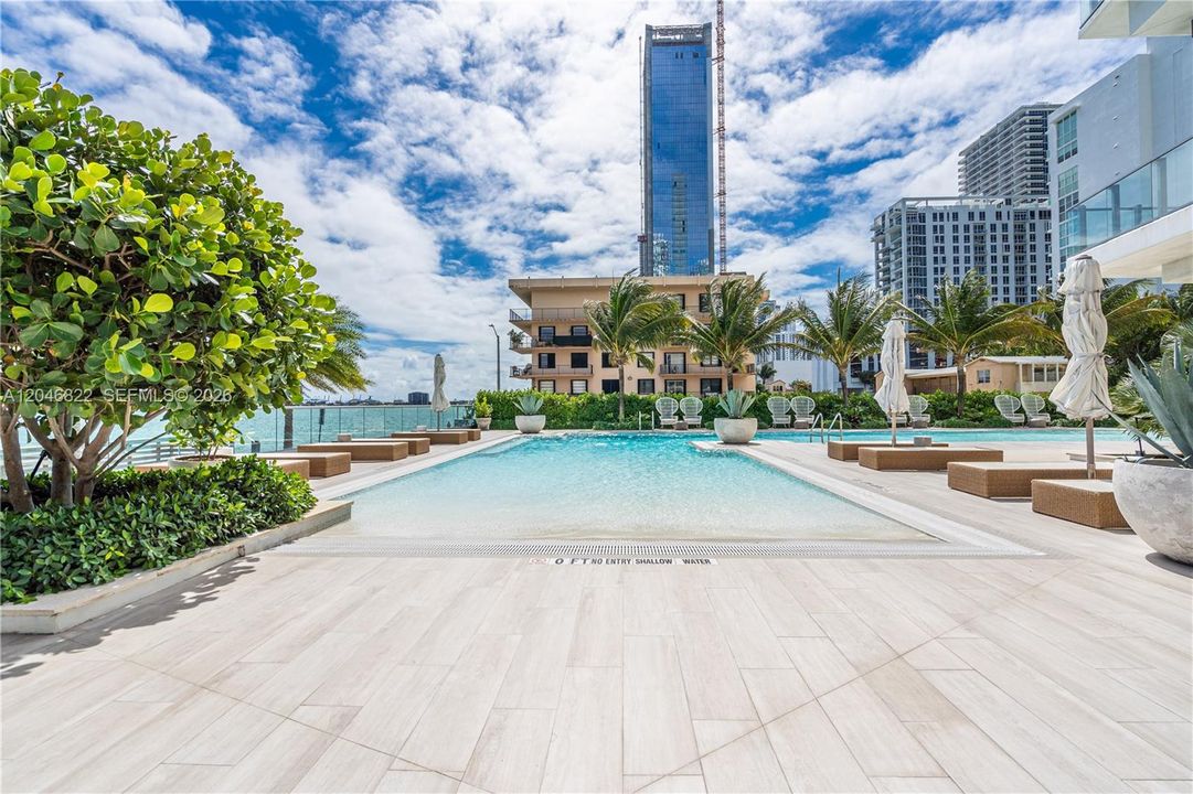 Expansive pool deck with bay views at Biscayne Beach