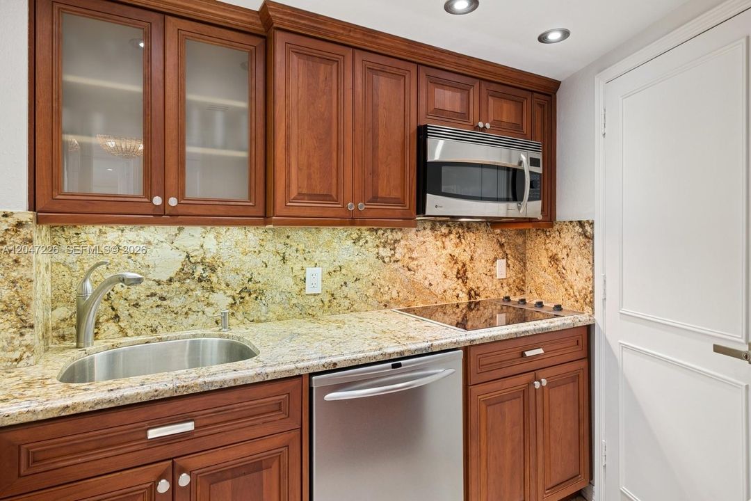 With cooktop, dishwasher and microwave