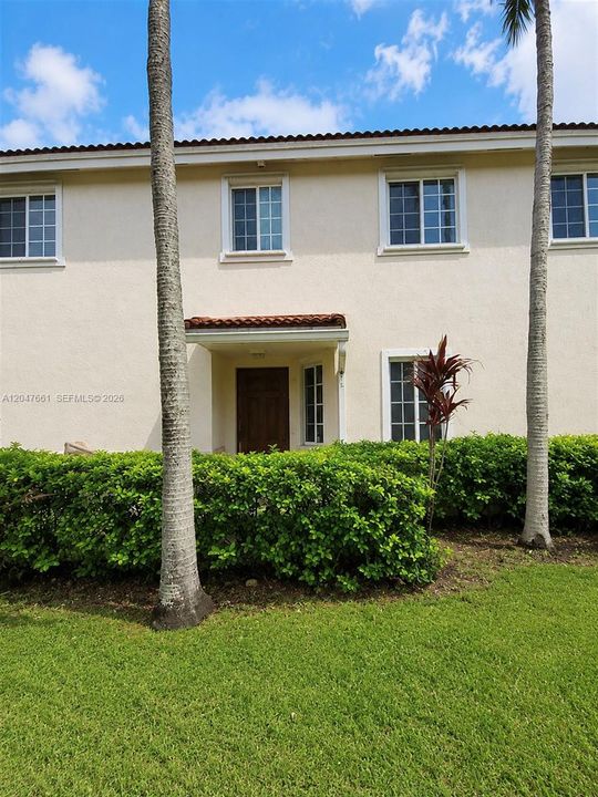 Private covered front entrance with welcoming curb appeal.