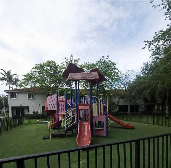 Fenced Community Playground offering a dedicated outdoor recreation space for residents.