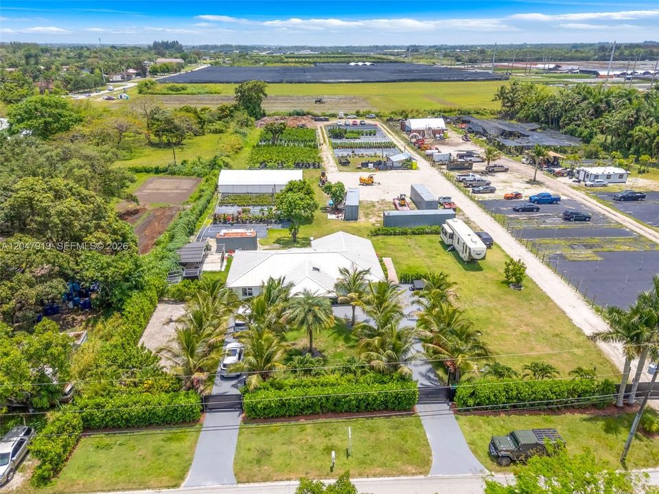 separate entry's a circle driveway w elect gates and a  service entry to rear or 2.75 ac approx. with house and another to adj property