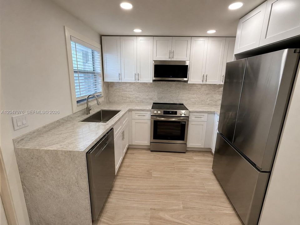 Virtual rendering, new quartzite counters being installed. This image is a virtual rendering for illustrative purposes only. Actual property conditions, features, and finishes may vary.