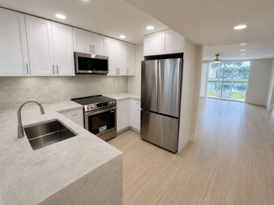 Virtual rendering, new quartzite counters being installed. This image is a virtual rendering for illustrative purposes only. Actual property conditions, features, and finishes may vary.