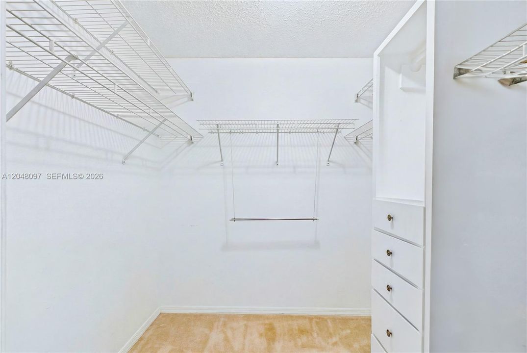 The SPACIOUS PRIMARY SUITE features a WALK-IN CLOSET