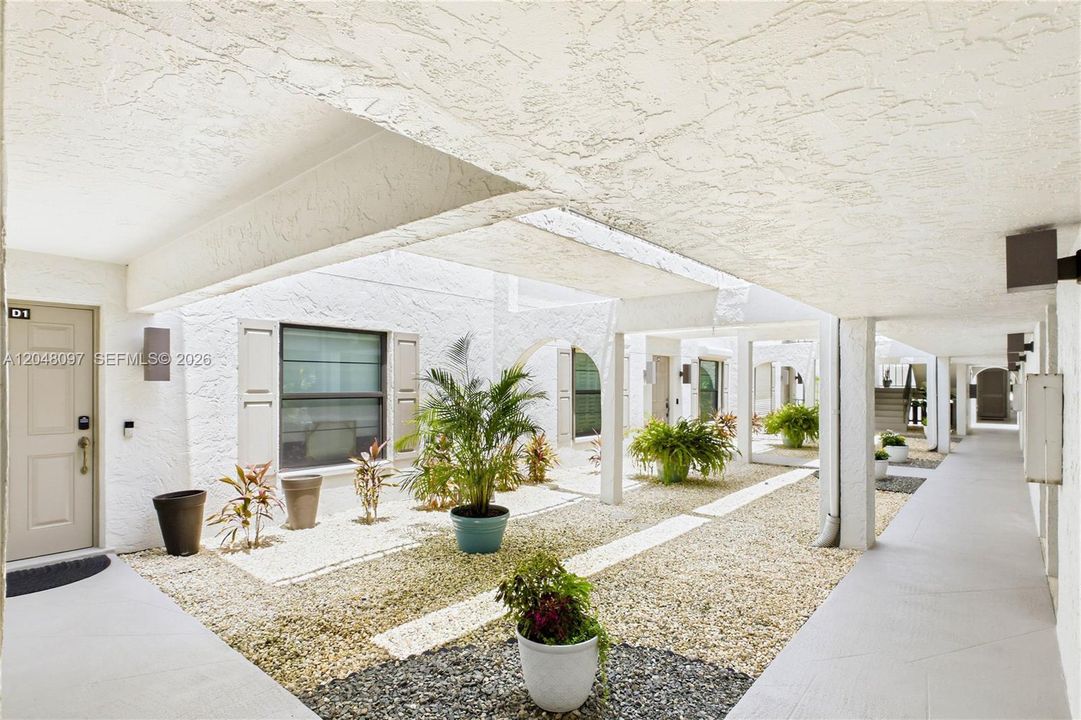 Covered walkway leading to the private second-floor entrance