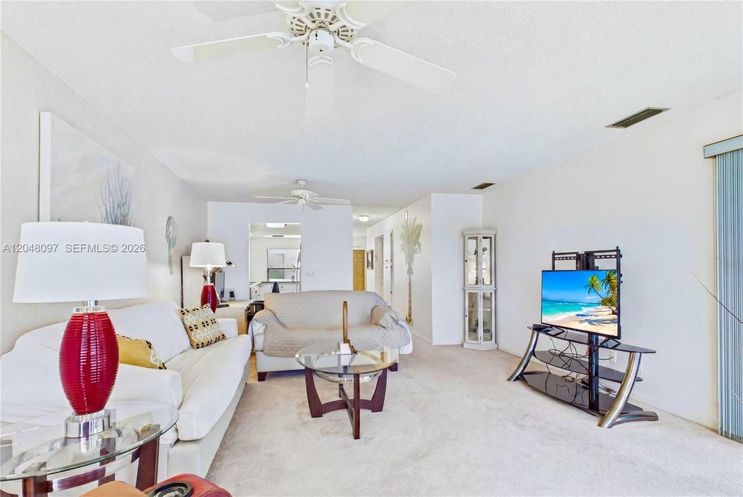 The spacious living room offers a bright, comfortable setting for everyday relaxation and entertaining