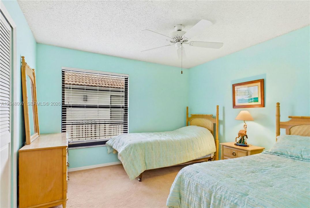 The GUEST BEDROOM is generously sized and versatile, perfect as a second bedroom, home office, or both