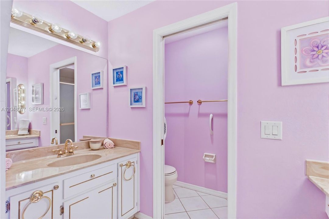 The SPACIOUS PRIMARY SUITE features a private bathroom with stand-up shower, makeup vanity and cabinetry