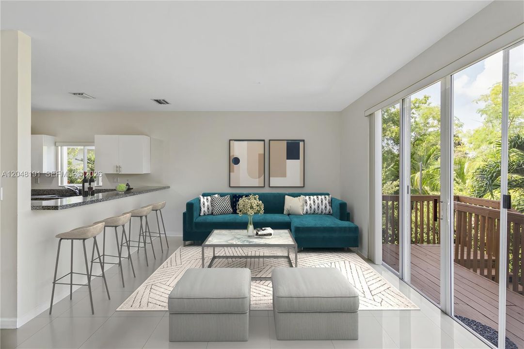 Family room off kitchen with access to deck and backyard