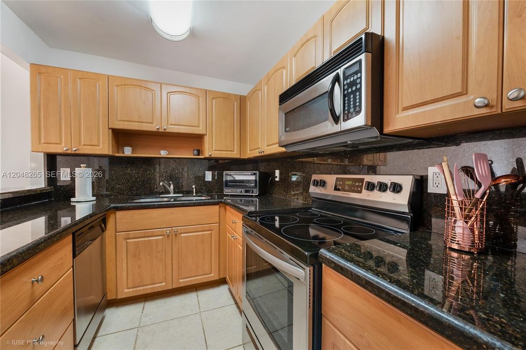 Ample kitchen with stainless steel appliances