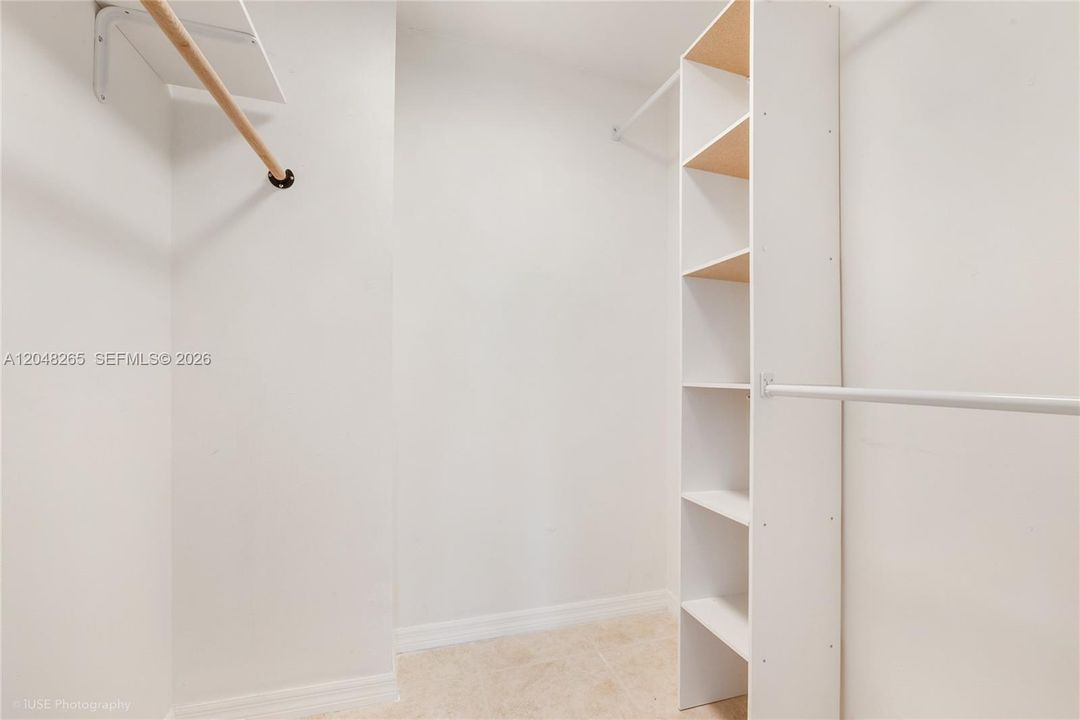 Fabulous walk-in closet offers plenty of storage